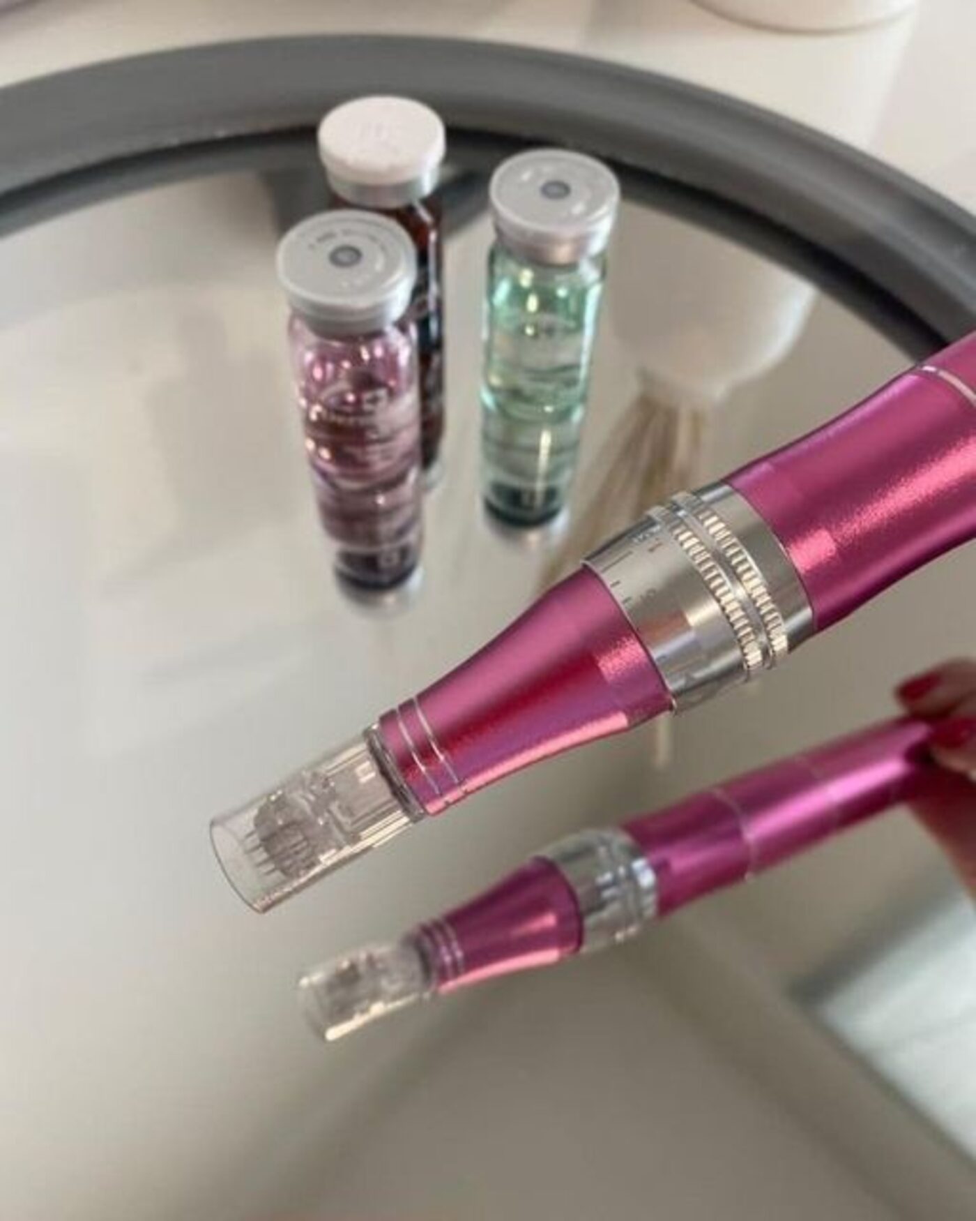 Microneedling pen with serum vials at Opal Aesthetics & Wellness