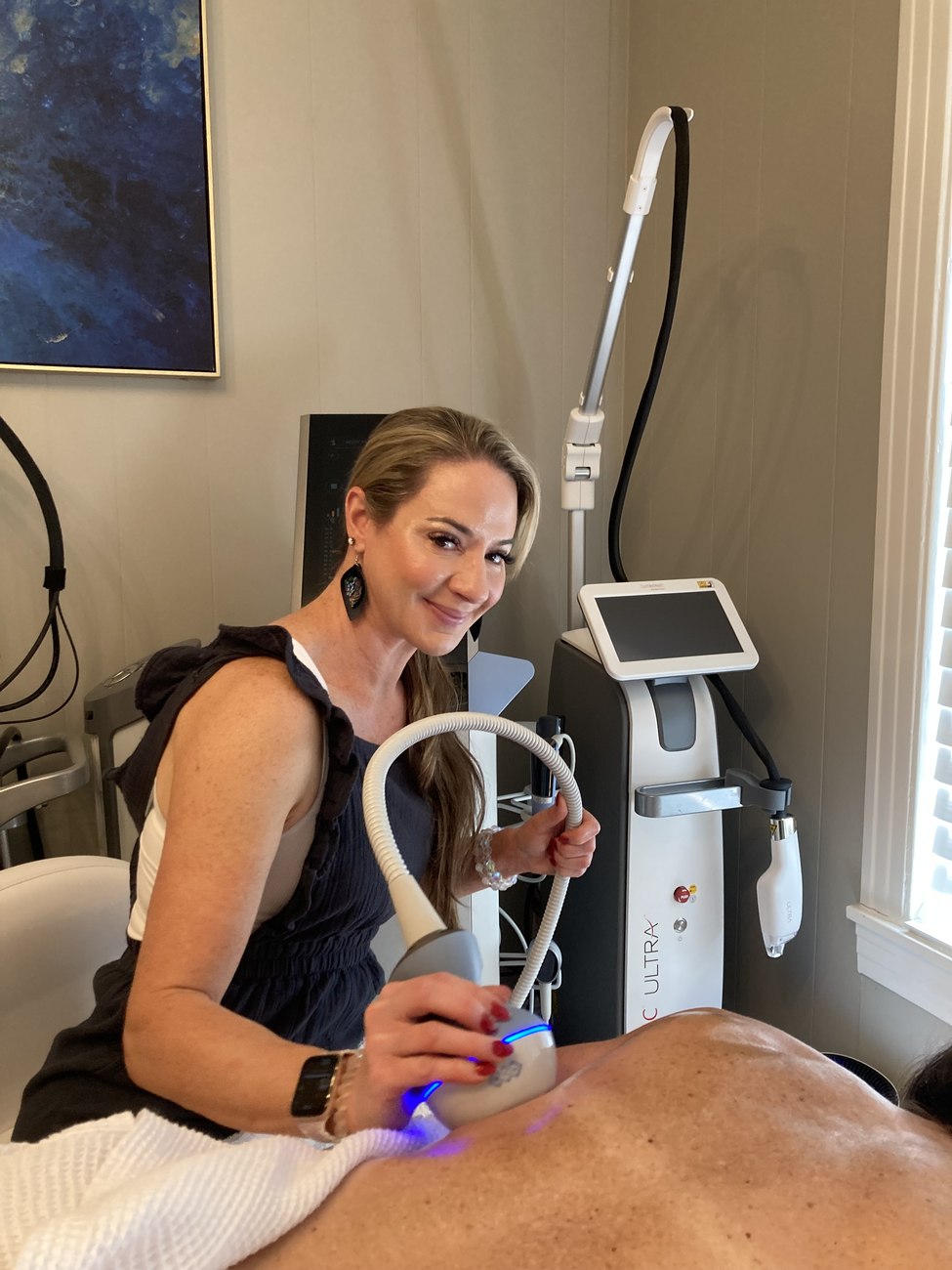 Priscilla performing an EXION skin tightening treatment at Opal Aesthetics & Wellness