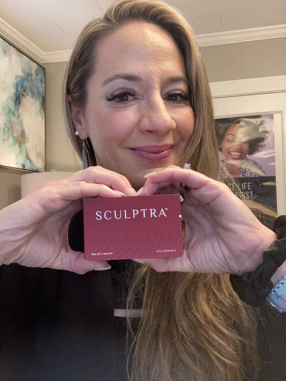 Priscilla holding a box of Sculptra at Opal Aesthetics & Wellness
